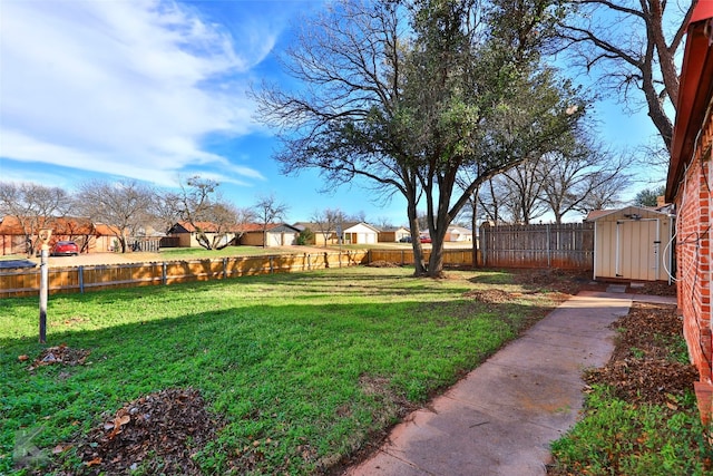 view of yard featuring a storage unit