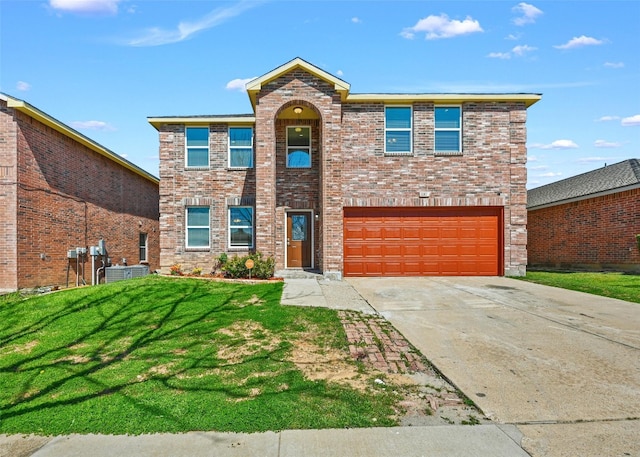 view of front property featuring a front yard, a garage, and central AC unit