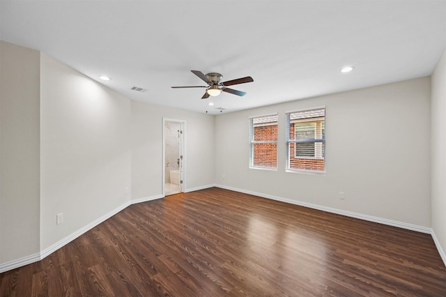 unfurnished room featuring ceiling fan and dark hardwood / wood-style flooring