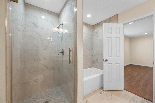 bathroom featuring separate shower and tub and hardwood / wood-style floors