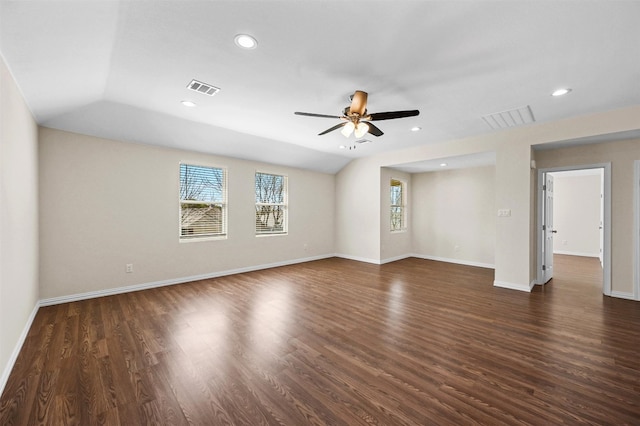 unfurnished room featuring vaulted ceiling, ceiling fan, and dark wood-type flooring