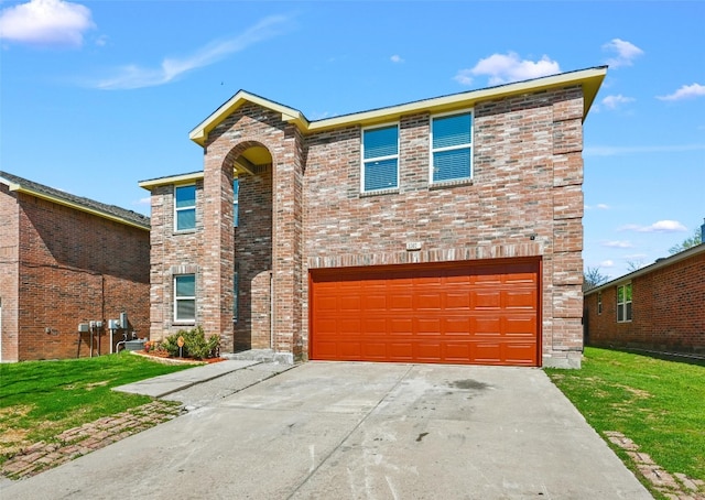 front facade with a front lawn and a garage