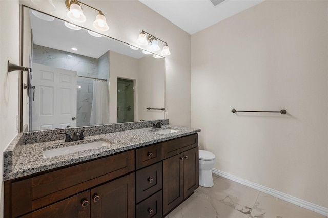 bathroom with toilet, dual sinks, large vanity, and tile flooring