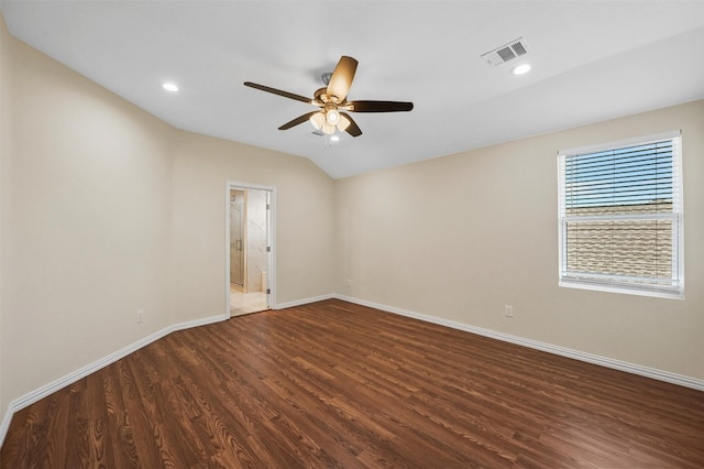 empty room with ceiling fan and dark hardwood / wood-style flooring