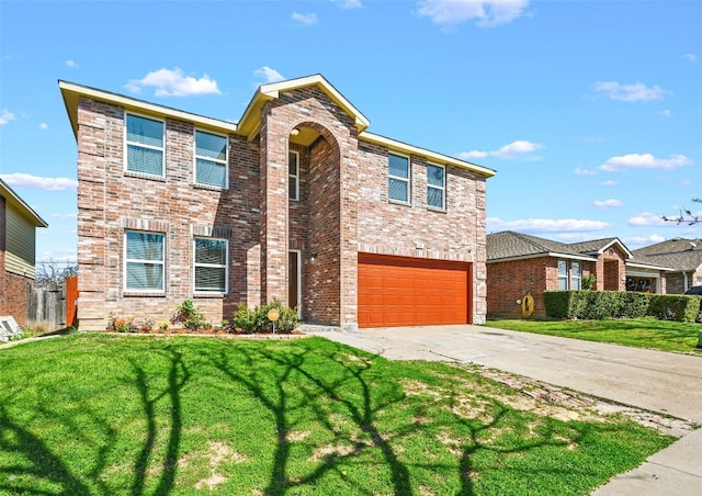 view of front of property with a front yard and a garage