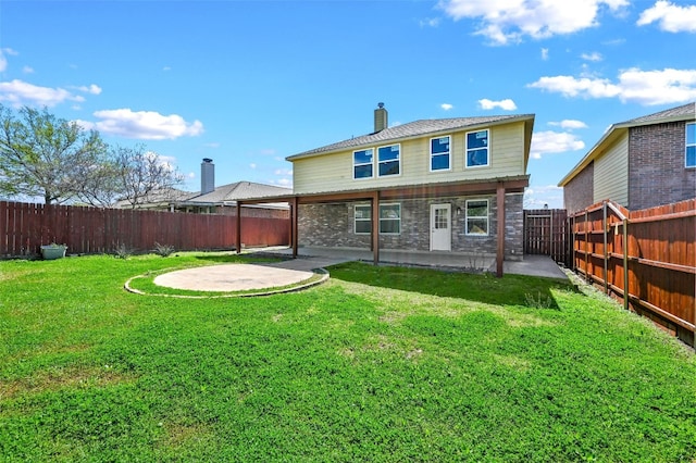 rear view of property with a patio area and a yard