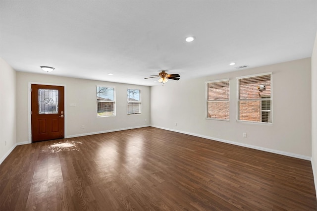 foyer featuring ceiling fan and dark wood-type flooring