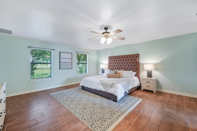 bedroom with hardwood / wood-style flooring and ceiling fan