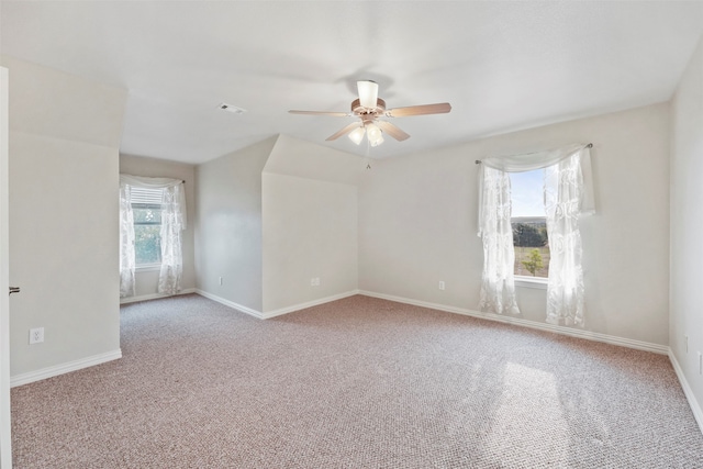 empty room with light carpet and ceiling fan