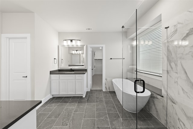 bathroom featuring plus walk in shower and vanity