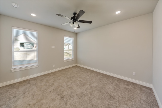 carpeted empty room with ceiling fan