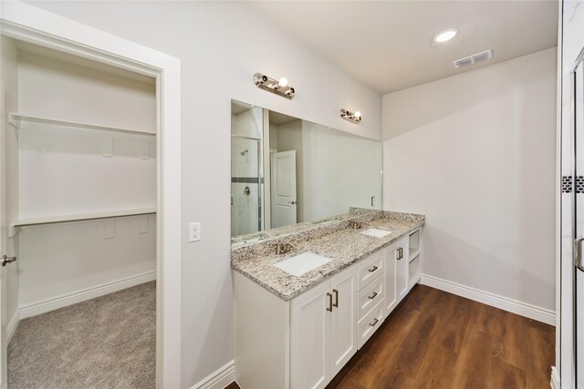 kitchen with white cabinets, stainless steel appliances, light hardwood / wood-style flooring, and gray cabinetry