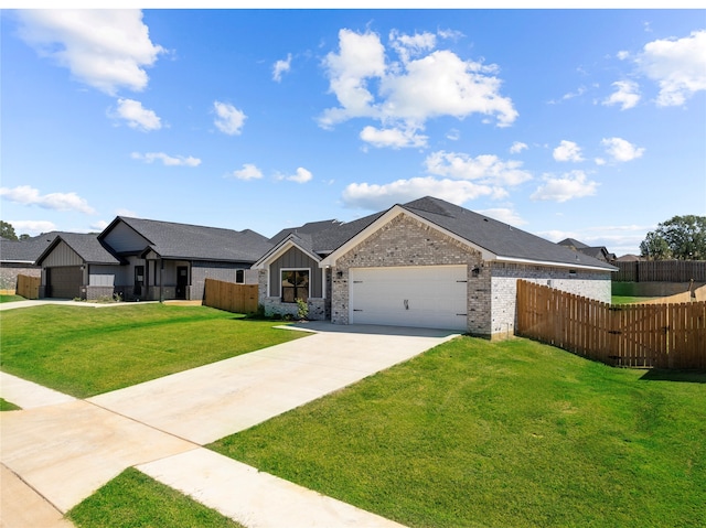 view of front of property with a front lawn and a garage