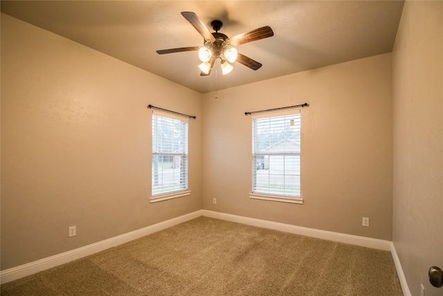 empty room featuring carpet floors and ceiling fan