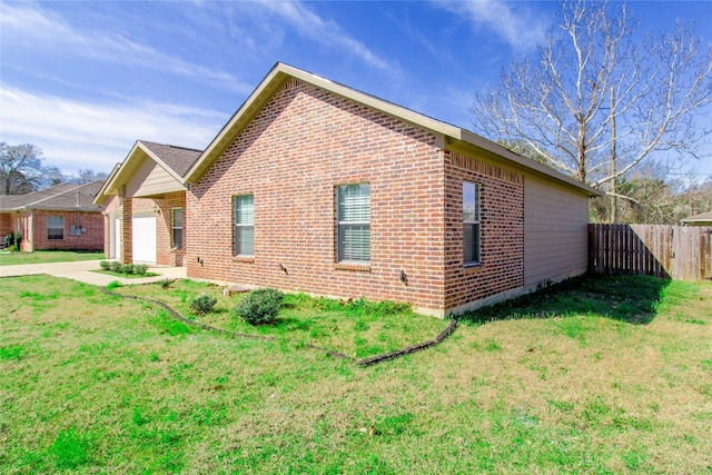 view of side of property with a yard