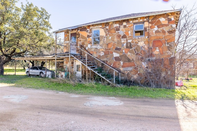 view of front of house with a carport