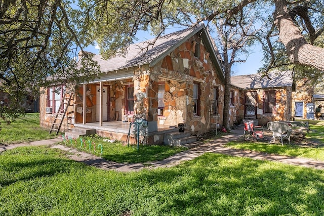 view of side of home featuring a lawn