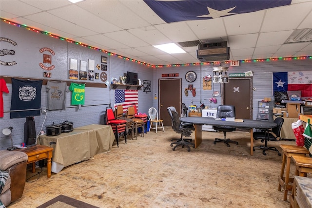 interior space featuring a drop ceiling