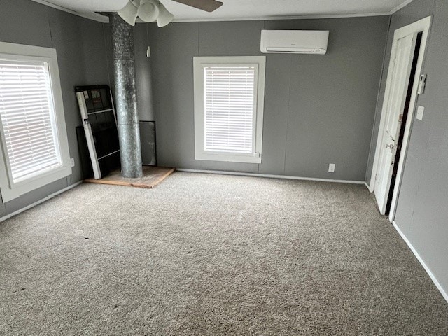 unfurnished bedroom with carpet flooring, a wall mounted air conditioner, and ceiling fan