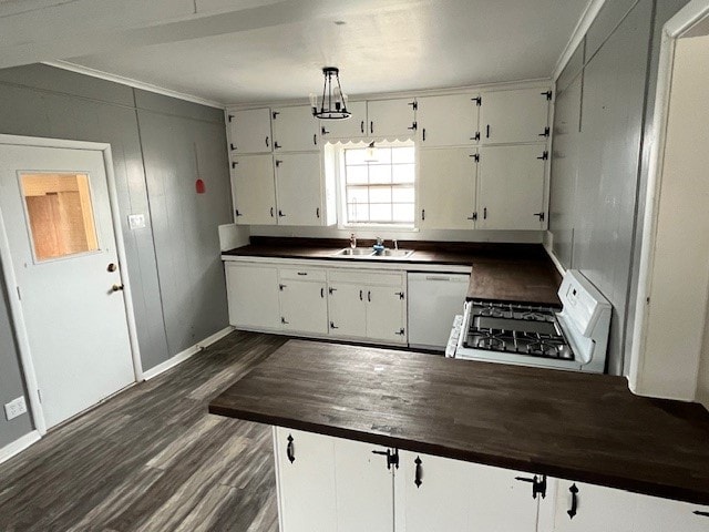 kitchen featuring hanging light fixtures, sink, white cabinets, dishwasher, and stove