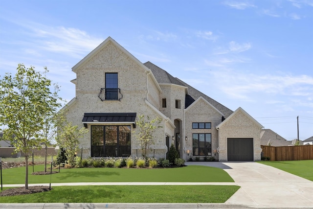 view of front facade with a front lawn and a garage