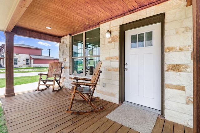 property entrance with covered porch