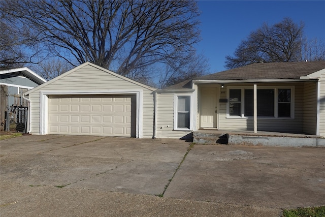 single story home featuring a porch and a garage