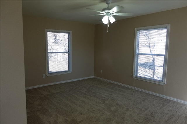 carpeted empty room featuring ceiling fan