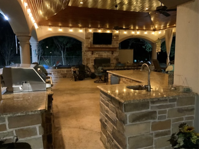 view of patio / terrace with area for grilling, ceiling fan, and sink