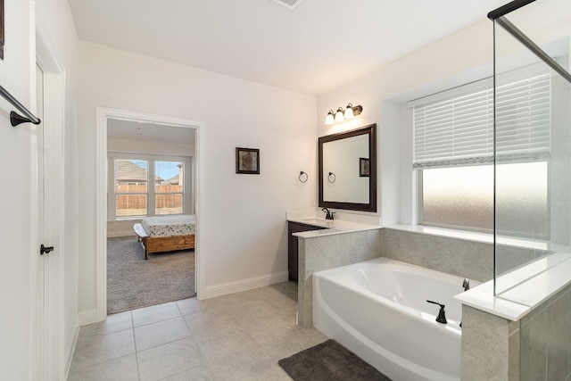 bathroom with sink, tile floors, and a washtub