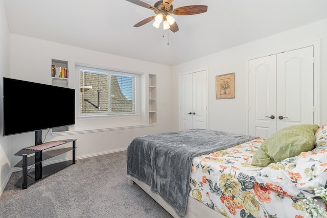 bedroom featuring multiple closets, ceiling fan, and light carpet