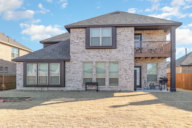 rear view of property with a patio area and a lawn