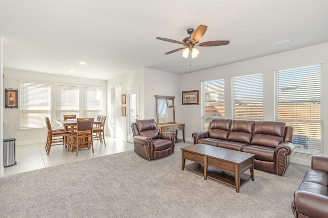 living room featuring ceiling fan and light carpet