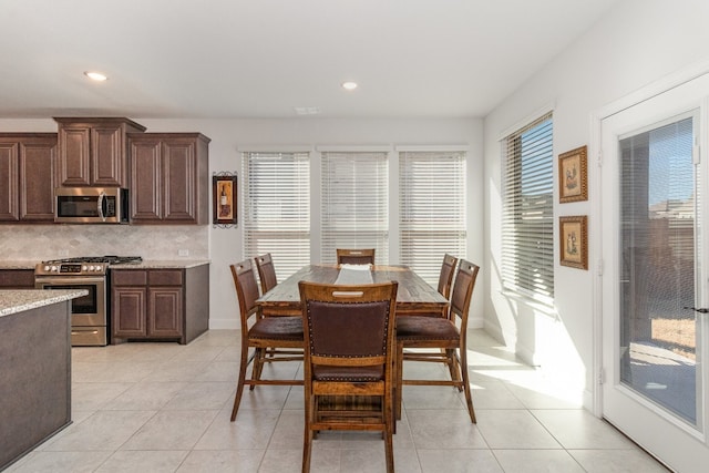 dining area with light tile floors