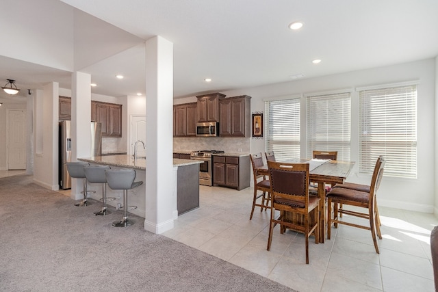 tiled dining area with a wealth of natural light