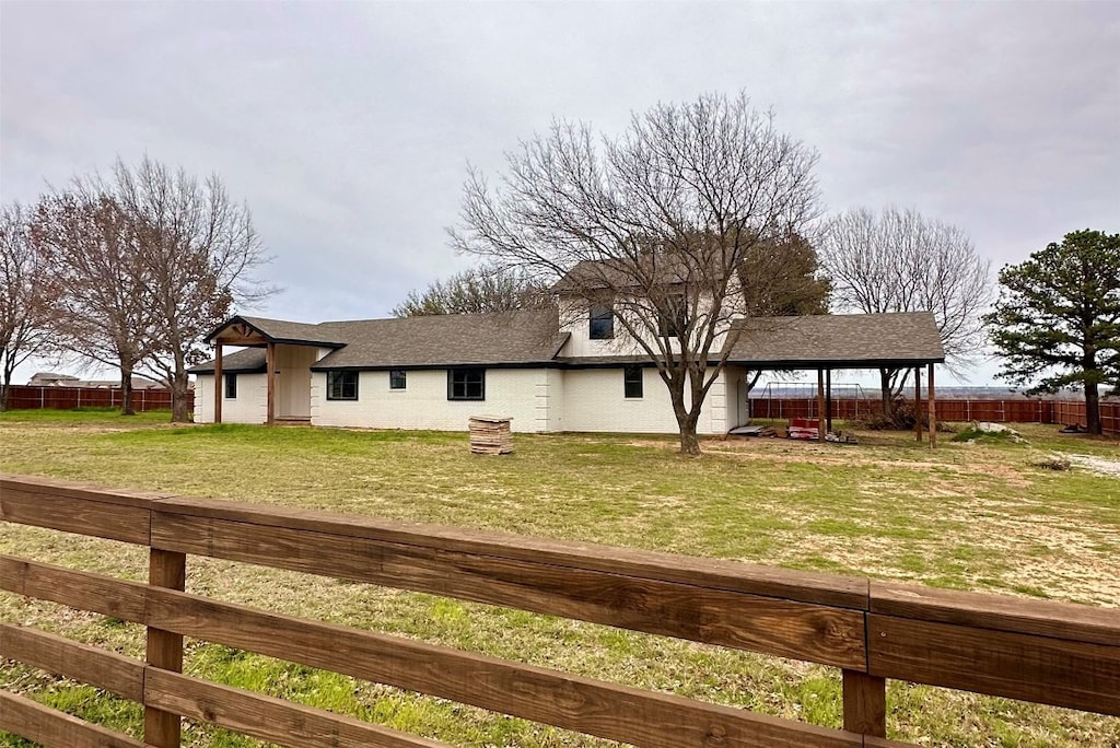 view of front of property with a gazebo and a front lawn