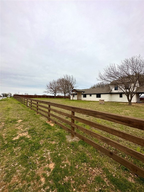 view of yard with a rural view