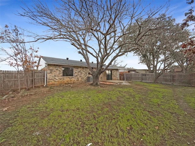 view of yard with central AC