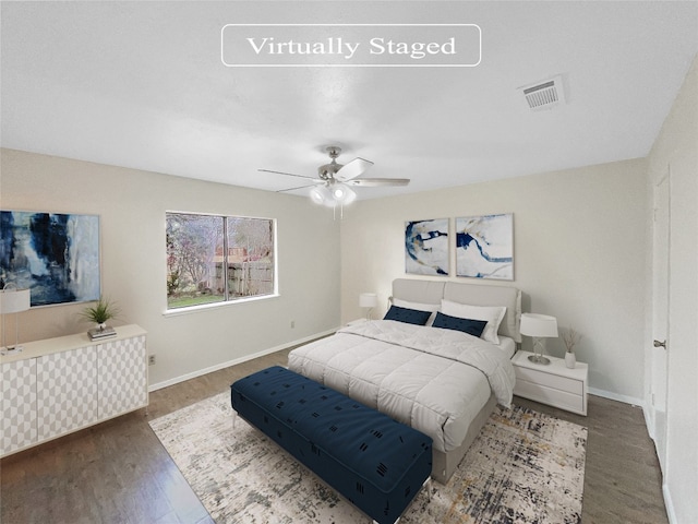 bedroom with ceiling fan and dark wood-type flooring