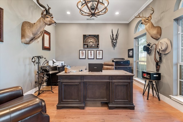 home office featuring crown molding, light hardwood / wood-style flooring, and a chandelier