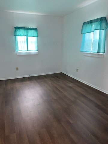 empty room featuring dark hardwood / wood-style floors