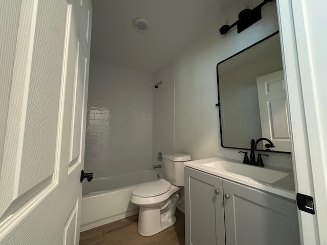 full bathroom featuring oversized vanity, shower / bathtub combination, toilet, and hardwood / wood-style floors