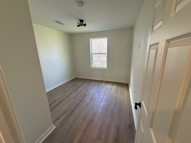 empty room featuring hardwood / wood-style floors