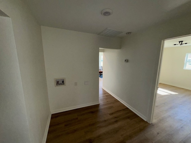 hallway with dark hardwood / wood-style floors