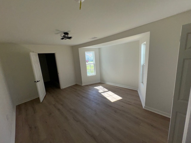 empty room with dark hardwood / wood-style floors