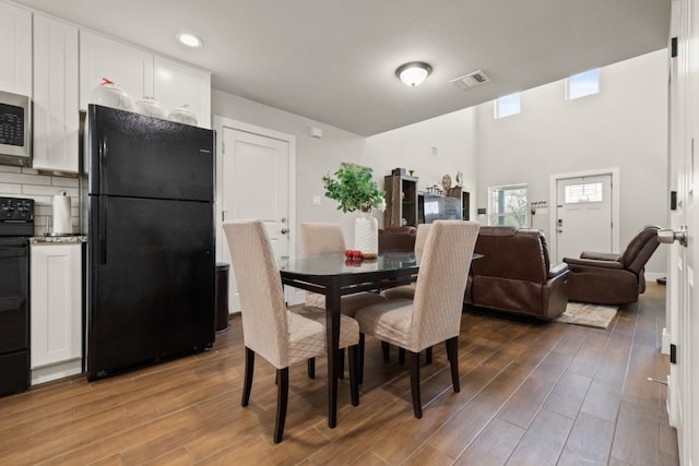 dining area featuring light wood-type flooring