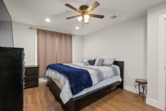 bedroom featuring hardwood / wood-style floors and ceiling fan