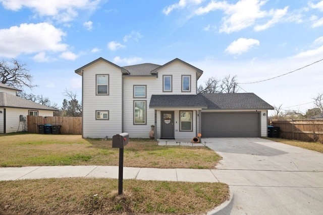 view of property featuring a front yard and a garage