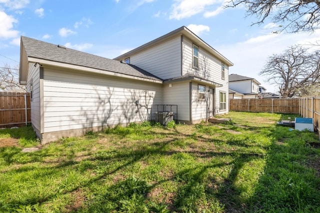 back of house featuring a yard