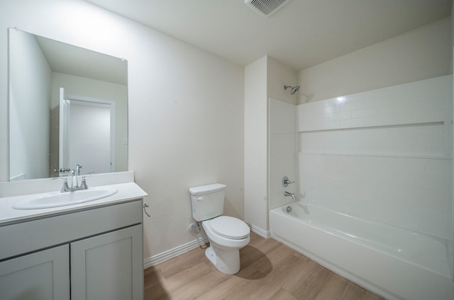 full bathroom featuring vanity, wood-type flooring, bathing tub / shower combination, and toilet